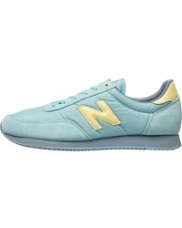new balance x90v1 cream and yellow trainers