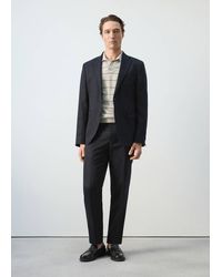 DESIGN - Pantalon de tailleur large en jersey à carreaux Prince de Galles