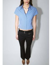 Mango - Flared Trousers With Welt Pockets - Lyst