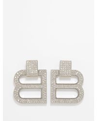 Balenciaga earrings shop bottle cap