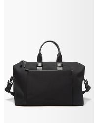 Mens Bags Duffel bags and weekend bags Troubadour Canvas Weekender Leather-trim Recycled-fibre Holdall in Black for Men 