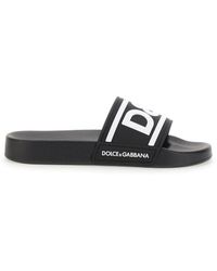 Damen Schuhe Flache Schuhe Flache Sandalen Dolce & Gabbana Calfskin sliders with DG logo in Weiß 