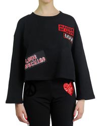 und Fitnesskleidung Sweatshirts Damen Bekleidung Sport- Moschino Baumwolle Sweatshirt mit Logo-Print in Schwarz Training 
