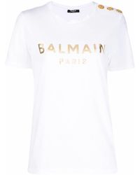 Balmain - T-Shirt mit Zierknöpfen - Lyst