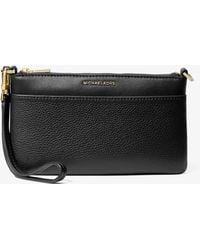 MICHAEL Michael Kors - Jet Set Medium Pebbled Leather Wristlet - Lyst