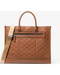 Michael Kors - Mk Jet Set Logo Embossed Leather Tote Bag - Lyst