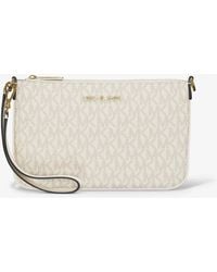 Michael Kors - Jet Set Small Signature Logo Convertible Wristlet - Lyst