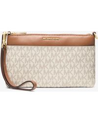MICHAEL Michael Kors - Jet Set Medium Signature Logo Wristlet - Lyst