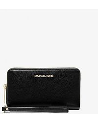 Michael Kors - Jet Set Large Leather Multifunction Phone Wristlet Wallet - Lyst