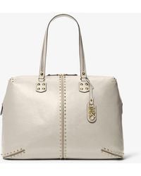Michael Kors - Borsa per il weekend Astor extra-large in pelle con borchie - Lyst