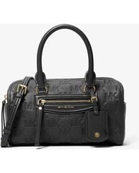 MICHAEL Michael Kors - Mk Jet Set Travel Extra-Small Logo Embossed Leather Duffel Crossbody Bag - Lyst