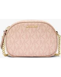 Michael Kors Outlet - Mk Jet Set Small Signature Logo Oval Crossbody Bag - Lyst