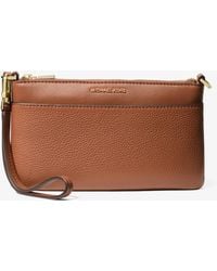 MICHAEL Michael Kors - Mk Jet Set Medium Pebbled Leather Wristlet - Lyst