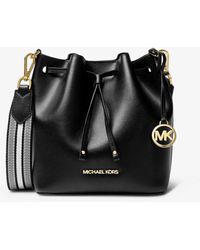 Bolsos saco Michael Kors de mujer desde 250 €