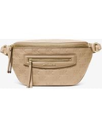 MICHAEL Michael Kors - Mk Jet Set Travel Medium Logo Embossed Leather Sling Pack - Lyst