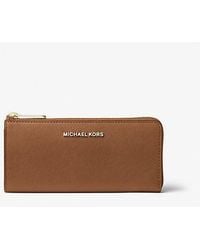 Michael Kors - Jet Set Travel Large Saffiano Leather Quarter-Zip Wallet - Lyst
