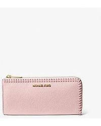 Michael Kors - Jet Set Travel Large Pebbled Leather Quarter-Zip Wallet - Lyst