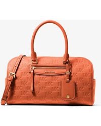 MICHAEL Michael Kors - Jet Set Travel Medium Logo Embossed Leather Duffel Crossbody Bag - Lyst