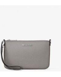 Michael Kors - Jet Set Small Pebbled Leather Convertible Wristlet - Lyst