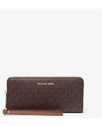 Michael Kors - Jet Set Travel Large Logo Continental Wristlet - Lyst