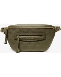 MICHAEL Michael Kors - Mk Jet Set Travel Medium Logo Embossed Leather Sling Pack - Lyst
