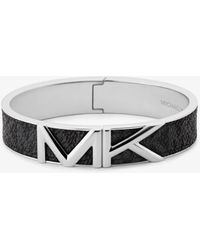Michael Kors Bracciale rigido Mott tonalità argento con logo - Metallizzato