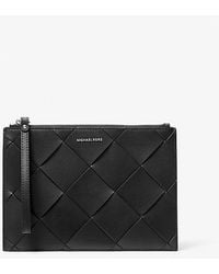 MICHAEL Michael Kors - Jet Set Travel Extra-Large Woven Leather Wristlet - Lyst