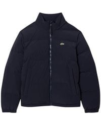 Lacoste - Jassen ,Blauw ,Leer Waterafstotend Donsjack Met Capuchon - Lyst