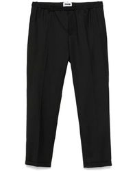 Magliano - Schwarze hose mit gürtel und taschen - Lyst