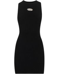 DIESEL - Kleedjes ,Zwart ,Polyester Zwarte Mouwloze Geribbelde Jurk Met Metalen Logo - Lyst