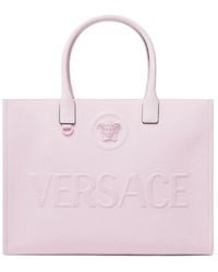 Versace - Rosa leder-tote-tasche mit medusa-kopf - Lyst