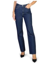 Calvin Klein - Jeans donna con chiusura a zip in tinta unita - Lyst