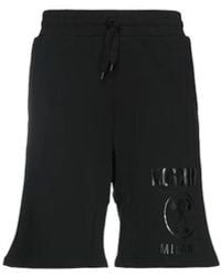 Moschino - Korte Broeken ,Zwart ,Katoen Zwarte Couture Logo Print Katoenen Shorts - Lyst