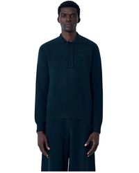 Lacoste - Tops ,Zwart ,Wol Logo Motif Polo Trui - Lyst