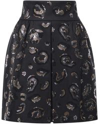 Genny - Short Skirts - Lyst
