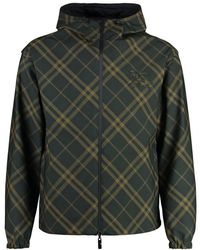 Burberry - Wendbare windjacke kariert schwarz ,wendbare karierte jacke mit kordelzugsaum - Lyst