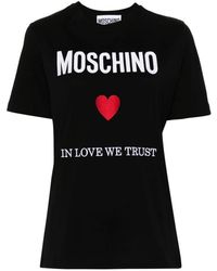 Moschino - Schwarze crewneck t-shirts mit logo-stickerei - Lyst