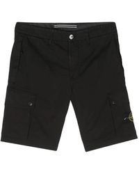 Stone Island - Slim fit bermuda cargo shorts nero - Lyst