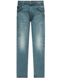Versace - Slim fit jeans blu - Lyst