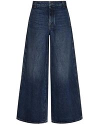 Khaite - Jeans blu a gamba larga con vita bassa e cuciture a contrasto - Lyst