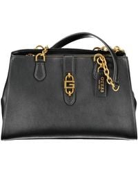 Guess - Schwarze polyurethan-handtasche mit schultergriffen und mehreren fächern - Lyst