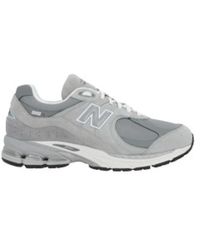 New Balance - Sneakers basse grigie in suede con gore-tex® - Lyst