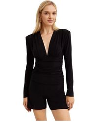 Norma Kamali - Schwarzer V-Ausschnitt Jumpsuit Mit Geraffter Taille - Lyst