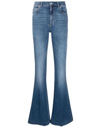 Alexander McQueen - Blaue denim flared jeans mit patch-logo - Lyst