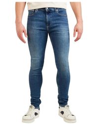 Calvin Klein - Blaue jeans mit reißverschluss/knopf und taschen - Lyst