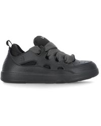 Sneaker uomo Oversize nera e oro da Uomo di Alexander McQueen in