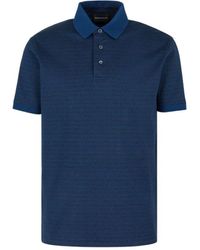 Emporio Armani - Blaues jersey-poloshirt mit all-over-schriftzug - Lyst