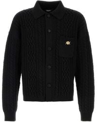 Versace - Truien & Vesten ,Zwart ,Wol Gebreide Trui Van Wol Met Gemengde Steken - Lyst