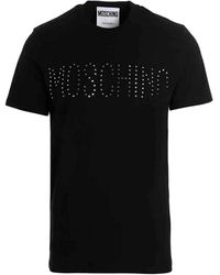 Moschino - T-shirt a maniche corte con logo in strass - Lyst