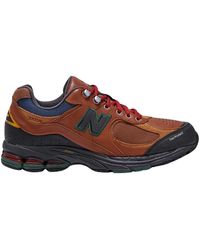 New Balance - 2002r all terrain marrone rosso squadra sneakers - Lyst